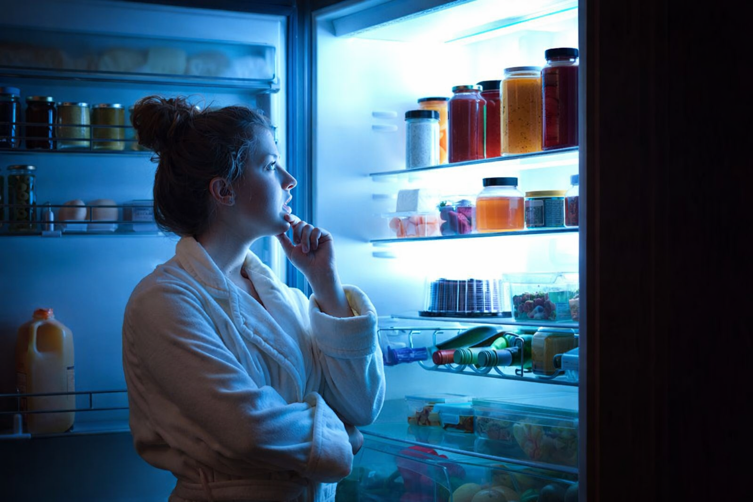 Woman checking what's inside the refrigerator