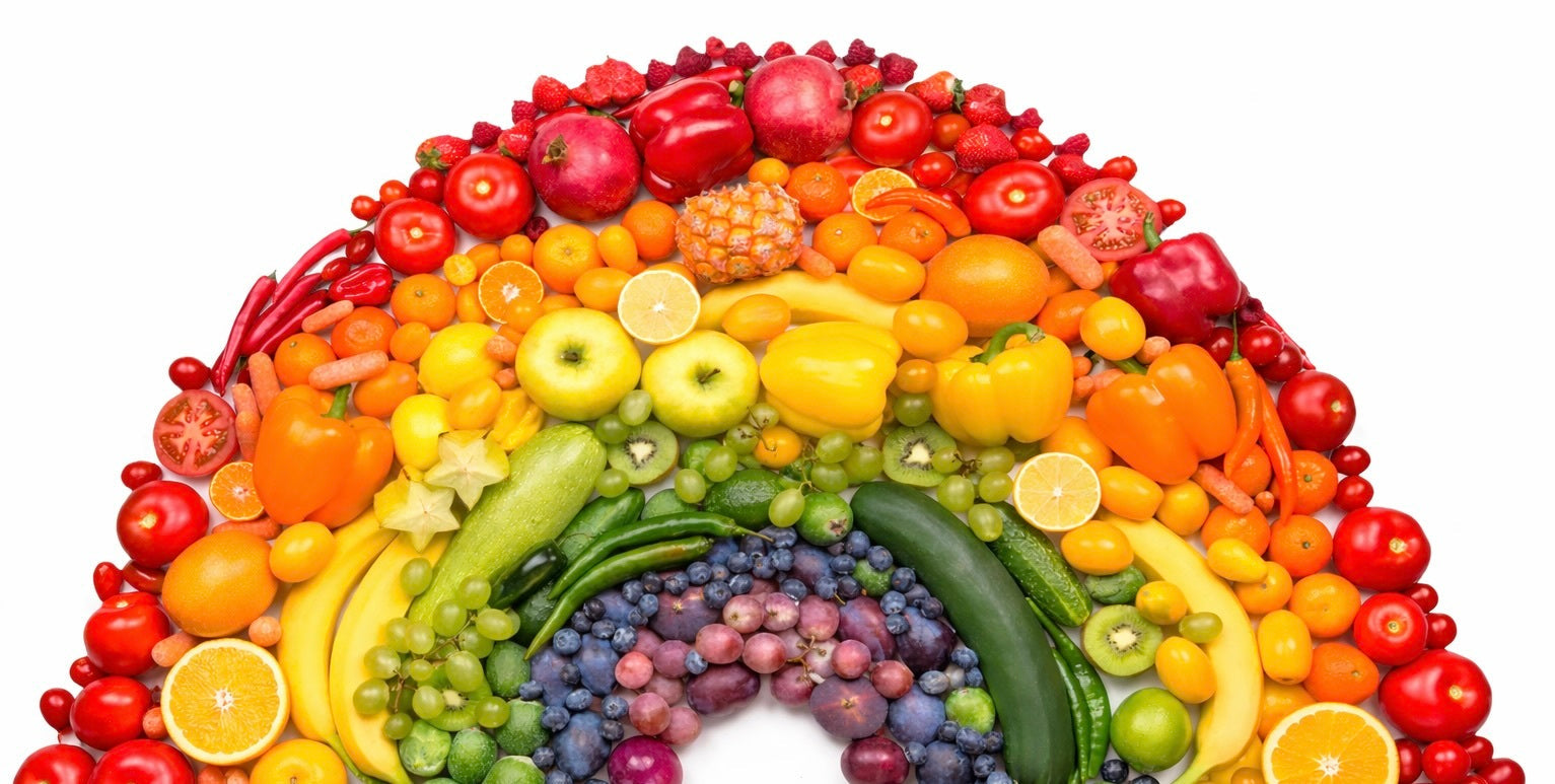 Different colors of fruits and vegetables lined up